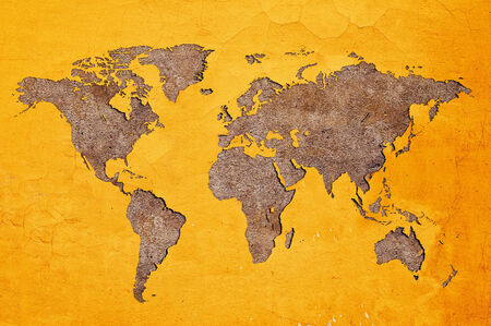 Earth shaped crack in Yellow wall with old plaster  as a background