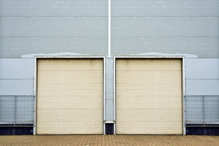 Industrial Unit with roller shutter doors. Warehouse storage doorsclosed.の写真素材
