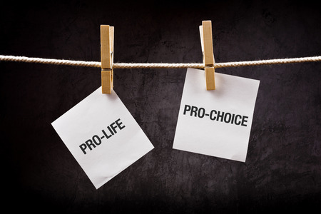 Pro-life vs pro-choice, female right on abortion concept