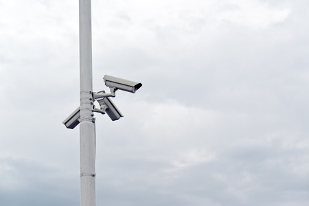 Security CCTV cameras mounted on the post for street surveilance.