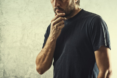 Forgetful Man Having Problems Remembering Something Important, Hand on Chin.の写真素材