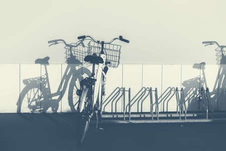 Bicycles and shadows, monochromatic imageの写真素材