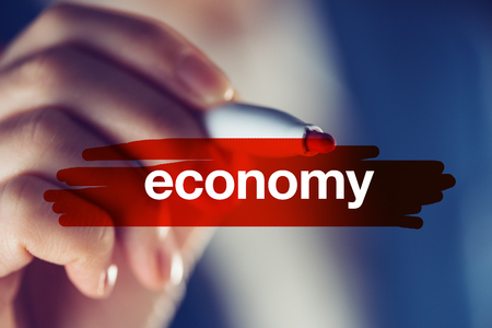 Business and economy concept, businesswoman highlighting wordの写真素材
