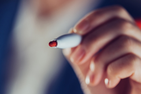 Teacher drawing with red marker felt tip pen, copy space for custom text or infographicsの写真素材