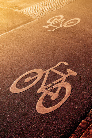 Bicycle lane road marking in urban surrounding, retro tonedの写真素材