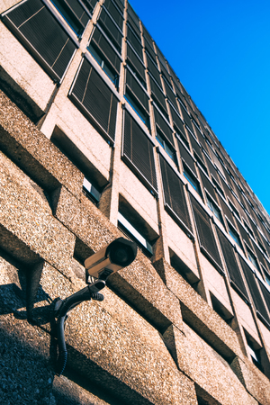 CCTV camera for surveillance on modern building facade, national security and government protection conceptの写真素材