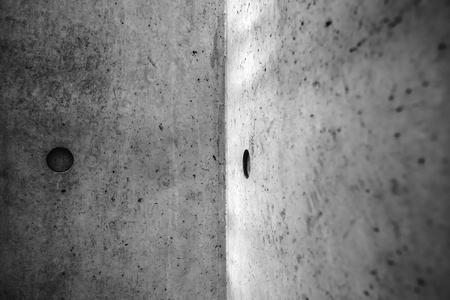 Abstract background of concrete cement wall texture, rough grungy scratched surface, selective focusの写真素材