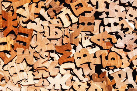 Pile of wooden letters as literacy and education backgroundの写真素材