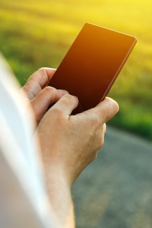 Mobile phone and internet addiction, female hands using smartphoneの写真素材