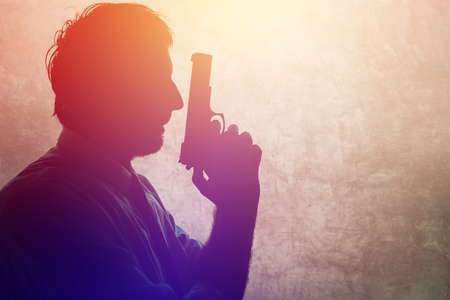 Silhouette of a man with a gun. Adult male person with handgun. Police detective, spy or secret...