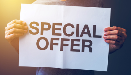 Man holding banner with Special offer text printedの写真素材