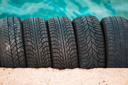 Used car tyres stack as background, selective focusの写真素材