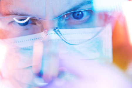 Medical science researcher performing scientific test in laboratory, female bioengineer working on development of new drugs and vaccines in pharmacyの写真素材