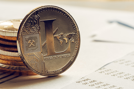 Litecoin cryptocurrency coinage on business office desk, selective focusの写真素材