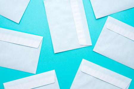 White mail envelopes mock up on blue background