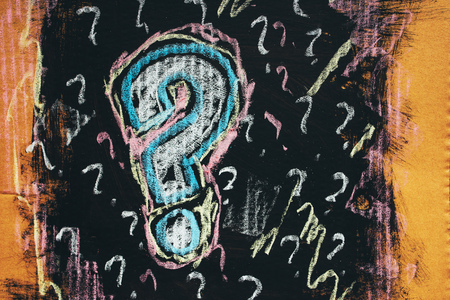 Sketched colorful question mark on cardboard paper, concept of perplex and confusionの写真素材