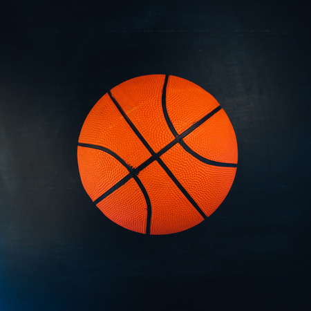 Basketball on dark background, copy space included