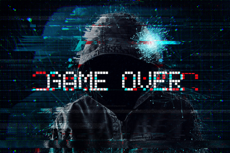 Game over concept with hooded video gamer and glitch effect