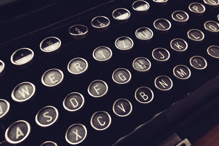 Close up of vintage typewriter machine keys on writers desk, conceptual image for blogging,...