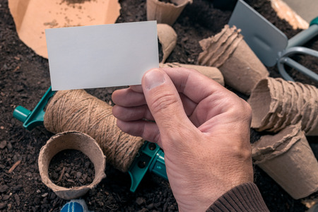 Organic gardener business card mock up, blank white card as copy space for homegrown food production small businessの写真素材