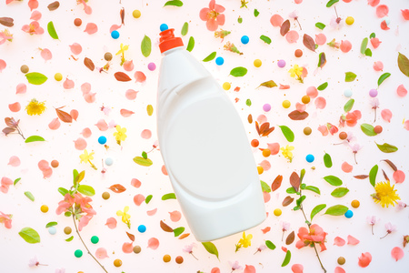 Liquid dish soap bottle mock up with springtime floral decorationの写真素材