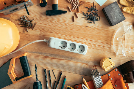 Power strip extension cord on carpentry woodwork woodwork desk, top viewの写真素材