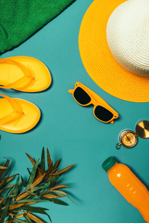 Travel accessories to enjoy summertime beach holiday vacation, top view flat layの写真素材
