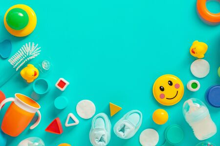 Baby boy personal accessories, top view on pastel background. Newborn infant care products and toys in flat lay arrangement.の写真素材