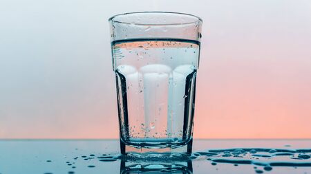 Carbonated soda water in drinking glass - refreshing fizzy sparkling mineral liquidの写真素材