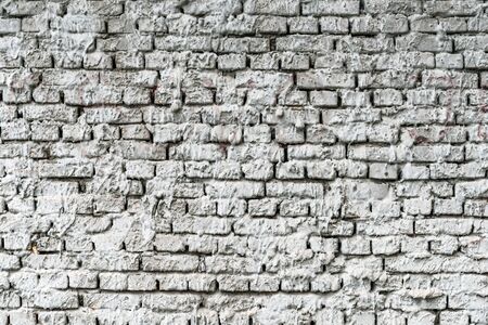 Mortar sprayed brick wall background, old house facade textureの写真素材
