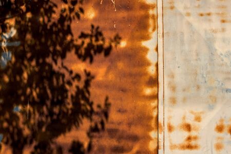 Shadow on rusty metal surface as abstract background