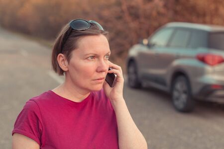 Woman lost during car driving through countryside talking on mobile phone trying to get help and...