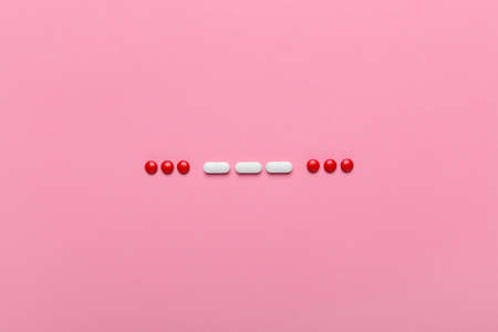 SOS morse code with medical drugs and pills, top view flat lay conceptual image for addiction and overuse of medicationの写真素材