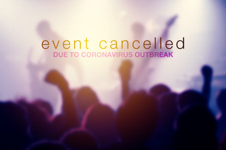 Event cancelled due to coronavirus outbreak, text over blur concert crowdの写真素材