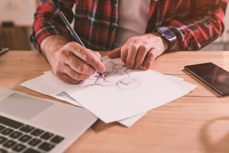 Illustrator freehand sketching motorcycle rider with pencil, selective focusの写真素材