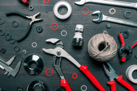 Plumbing tool set on working desk, top view flat lay objects