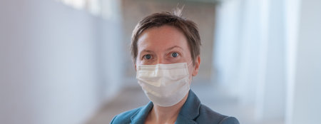 Business woman with protective face mask during Covid 19 pandemics, selective focusの写真素材
