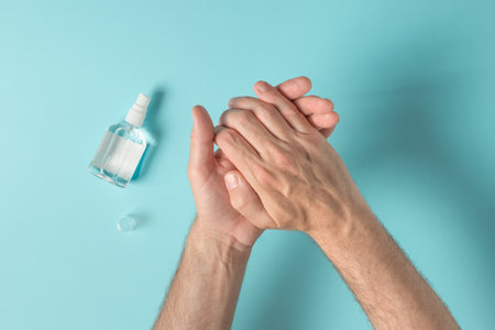 Hands using disinfecting antibacterial spray, health care and hygiene conceptの写真素材