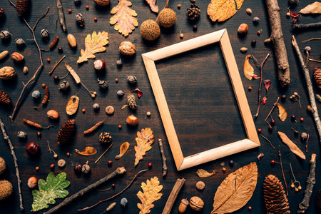 Empty wooden picture frame mock up with autumn season decoration, flat lay top view copy space
