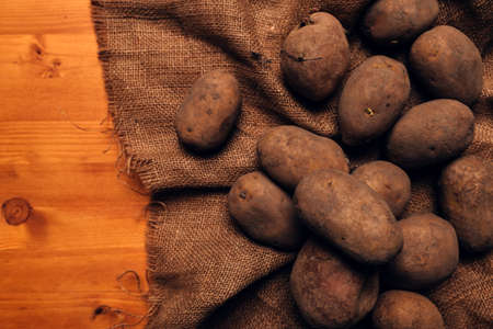 Pile of harvested potato tubers, selective focusの写真素材
