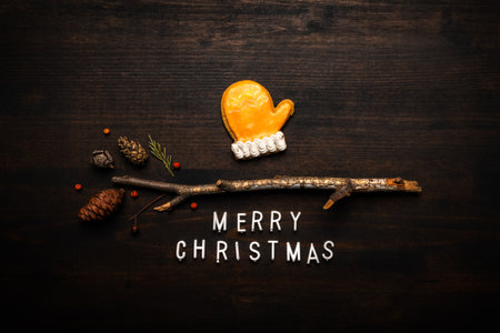 Gingerbread mitten and Merry Christmas text flat lay top viewの写真素材