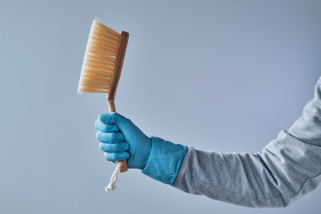 Ready for house cleaning, man with brush cleaning equipment