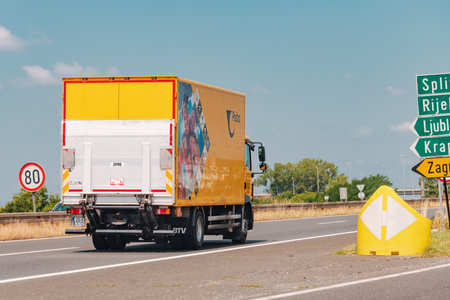 ZAGREB, CROATIA, JULY 20. 2021: Croatian Post (Hrvatska Posta) delivery truck on highway road near Zagreb, illustrative editorial. Croatian Post normally delivers 90% of parcels the next day.のeditorial素材