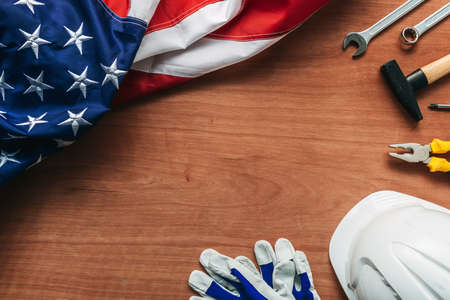 American Labour day concept, top view flat lay with USA flag and tools on wooden desk, directly aboveの写真素材