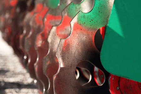 Close up of tractor disc harrows, agricultural machinery equipment, selective focus
