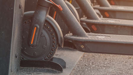 Electric scooters parked at city square for rent, selective focusの写真素材