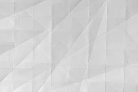 Texture of folded white paper as background, top viewの写真素材