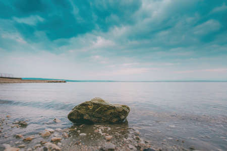 Kvarner bay seascape seen from Crikvenica, small town northern Adriatic sea coast of Croatia, clear sky over the horizon in early summer morningの写真素材