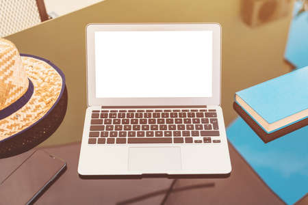Working on vacation, laptop mock up screen on apartment balcony in summer morning, selective focusの写真素材