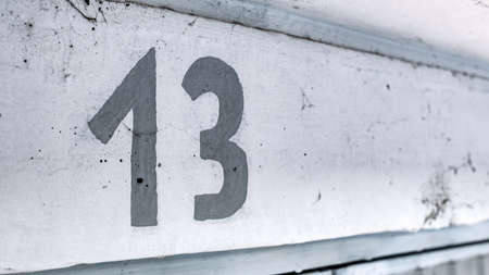 Number thirteen above car garage door, selective focusの写真素材